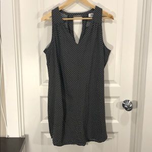 Sleeveless black dress/tunic with white details.